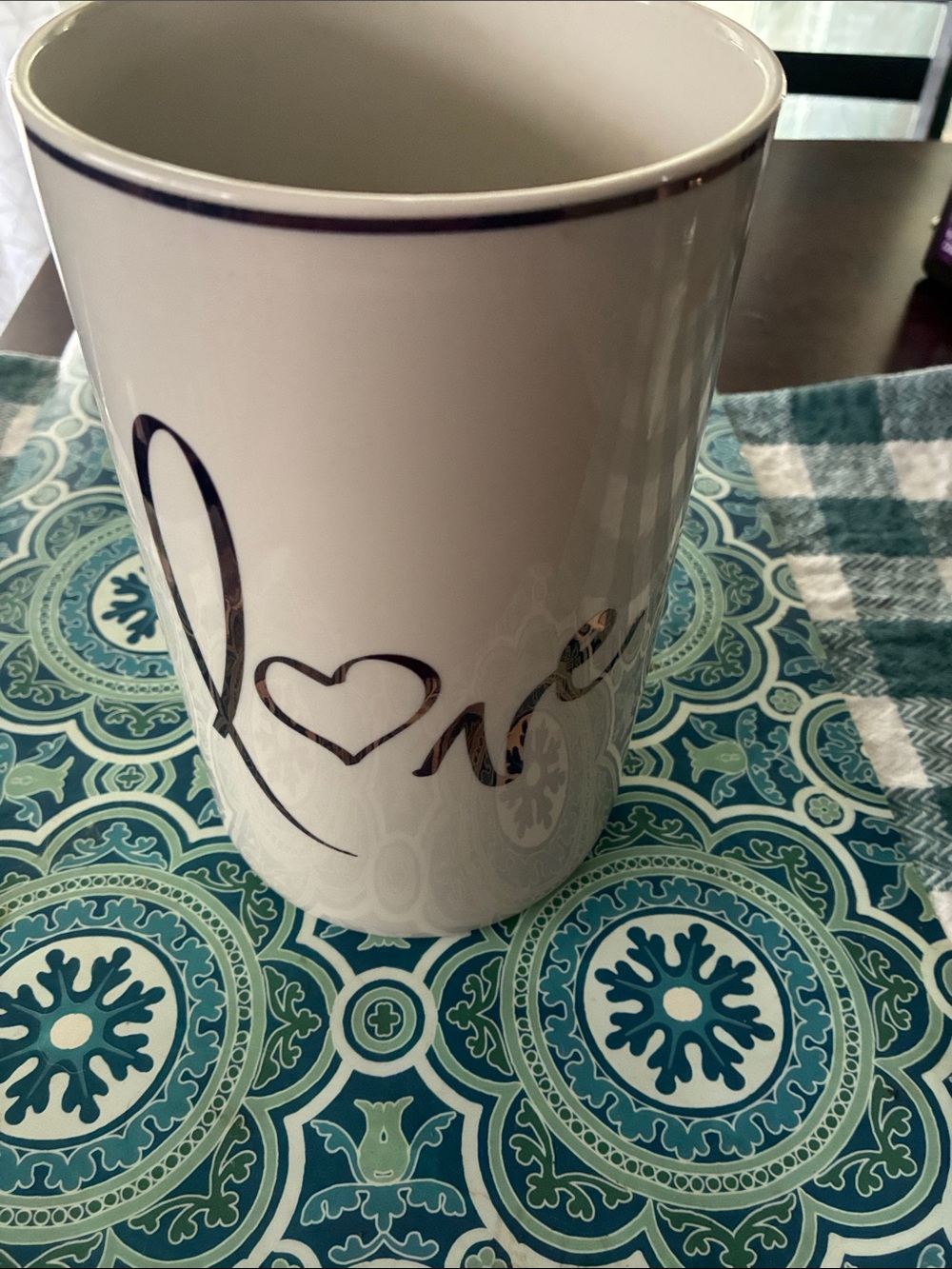 White Ceramic vase with Metallic Script Accent. I used this in my kitchen .